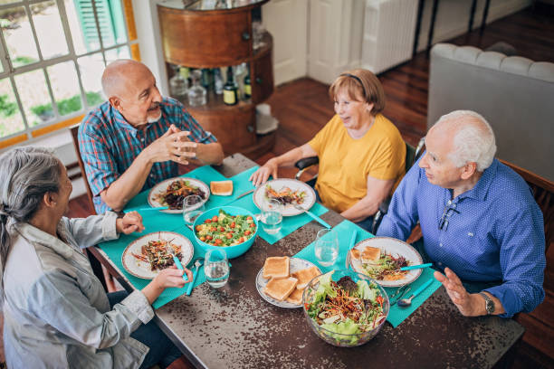 istock Senior friends having dinner together 1199849262