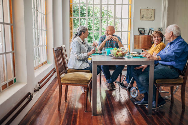istock Senior friends having dinner together 1199849405