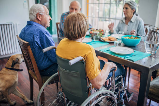 istock Senior friends having dinner together 1199849957