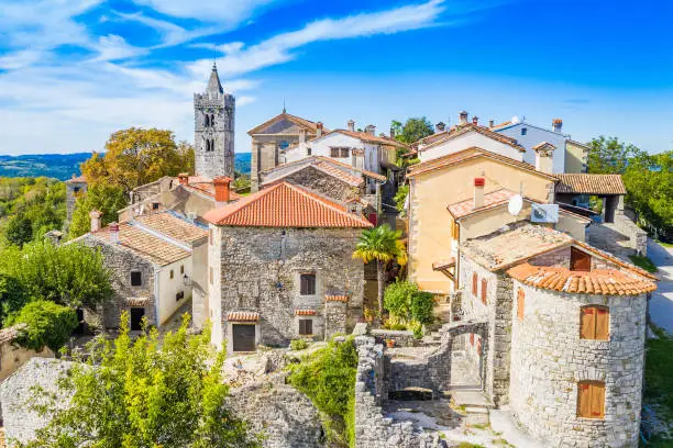 Beautiful old town of Hum, stone houses and church tower bell, romantic traditional architecture in Istria, Croatia, aerial view from drone