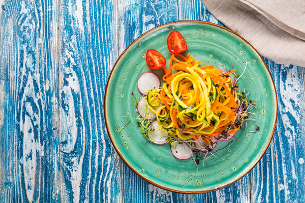 istock Vegetable pasta from carrot and zucchini. Served on a ceramic plate. 1199850709