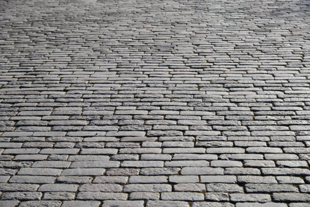 istock Old cobblestone pavement close-up. 1199853642