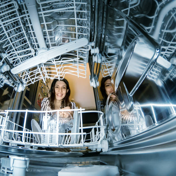 istock Woman using dishwasher in the kitchen 1199853747