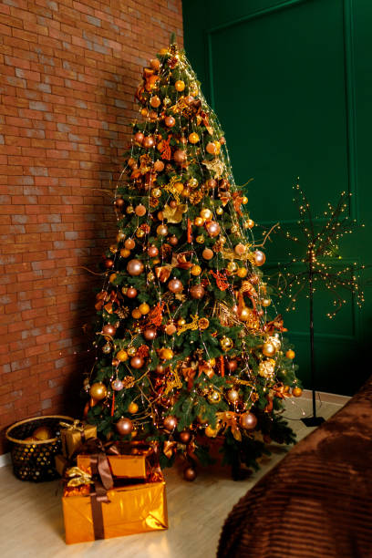 istock Golden Boxes Of Presents Under The Christmas Tree 1199853763