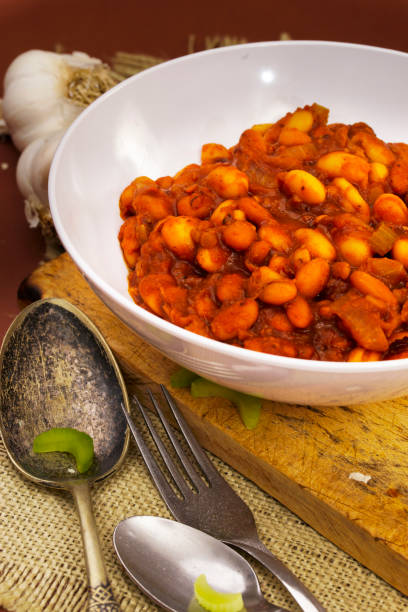 istock Baked Beans in White Bowl with Silverware on Side 1199853952