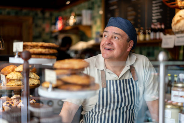 Thoughtful man working as a waiter at a pastry shop