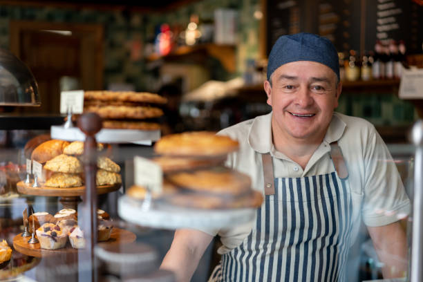 istock Happy man working at a cafe 1199858275