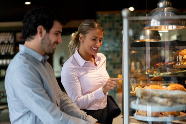 istock Happy couple buying pastries at a bakery 1199858325