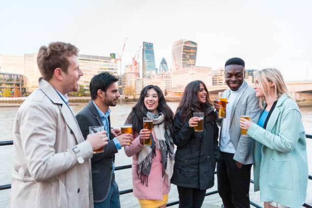 istock Happy business people drinking beer after work in London 1199861199
