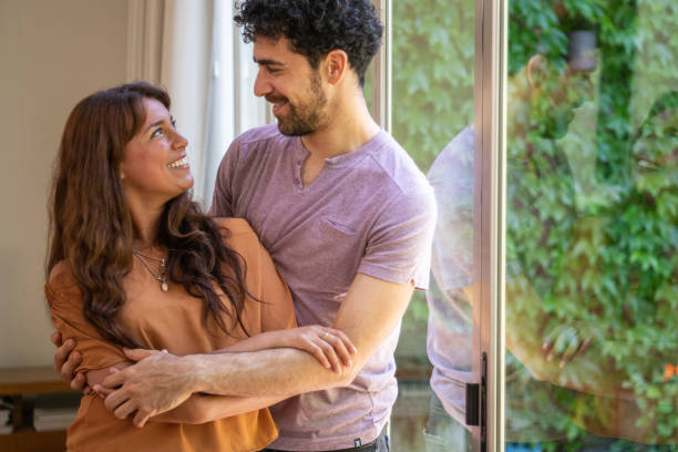 istock Young heterosexual couple embracing and looking at each other 1199861340