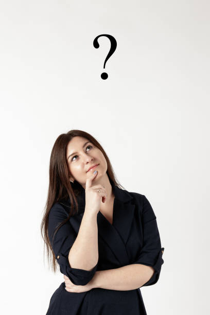 istock Young woman in blue and Question Mark. Question Mark. 1199861367