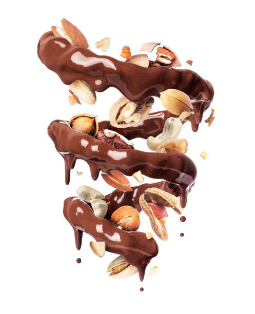 istock Chocolate splashes in spiral shape with with various nuts, isolated on a white background 1199862605