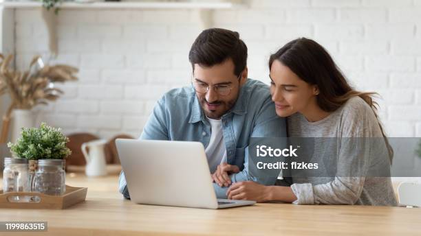Happy Young Mixed Race Married Spouse Making Purchases Online Stock Photo - Download Image Now