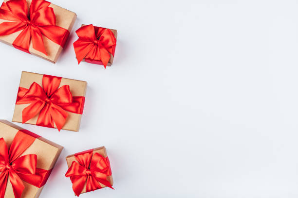 istock Frame of cardboard gift boxes with red bows. 1199865319