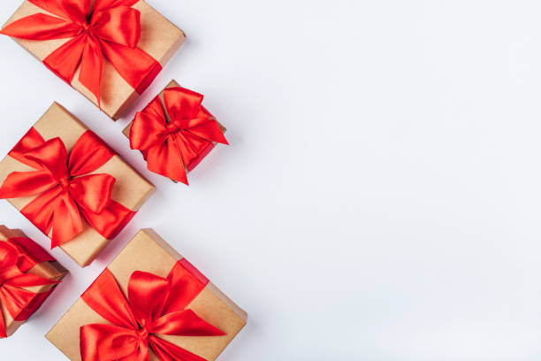 istock Frame of cardboard gift boxes with red bows. 1199865320