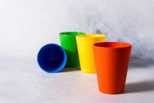 istock group color plastic cups on gray stone background plastic waste 1199866171