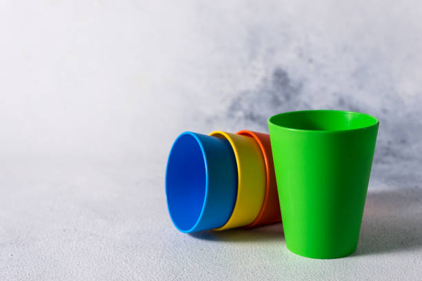 istock group color plastic cups on gray stone background plastic waste 1199866178