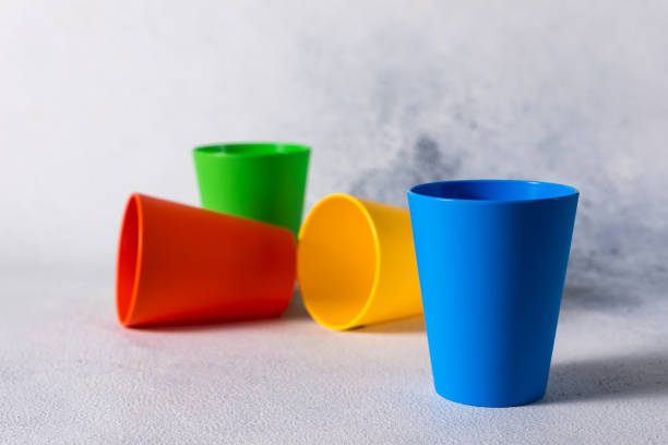 istock group color plastic cups on gray stone background plastic waste 1199866186