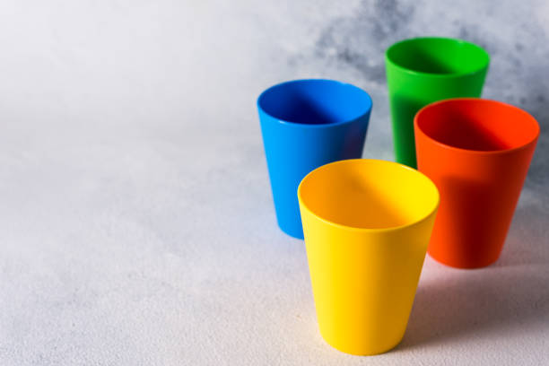 istock group color plastic cups on gray stone background plastic waste 1199866191