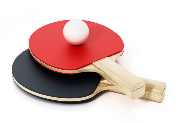 A table tennis bat ping pong paddle with ball on white