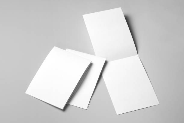 istock Blank half-folded blank booklets, postcards, flyers or brochures on gray 1199867964