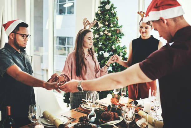 istock Their tradition is to say grace before digging in 1199869754
