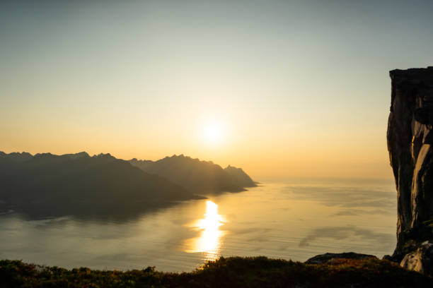 istock Sunset at cliff wall and fjord 1199871984
