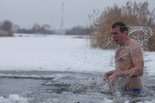 istock A man in an ice hole. 1199873522