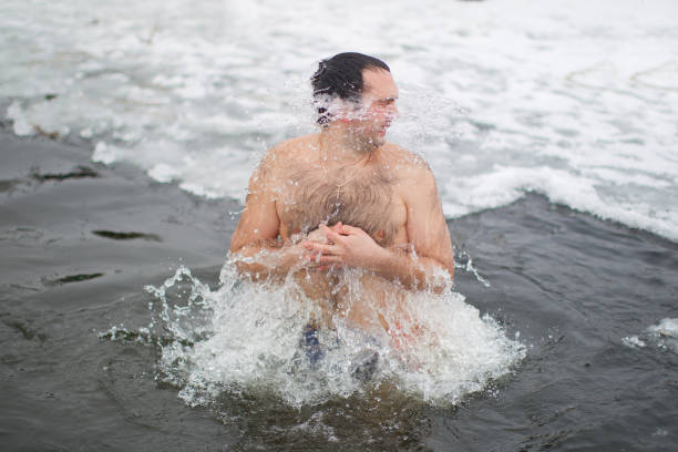 istock A man in an ice hole. 1199873528