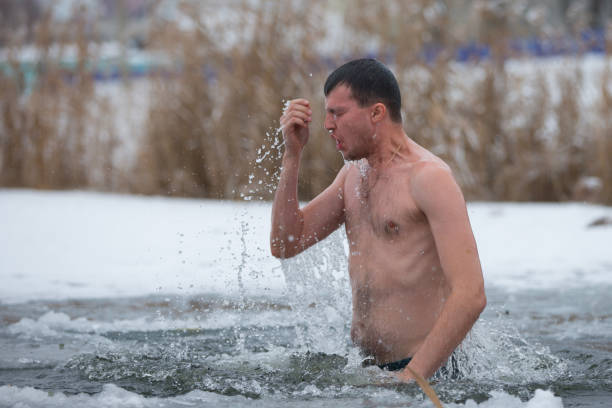 A man in an ice hole.