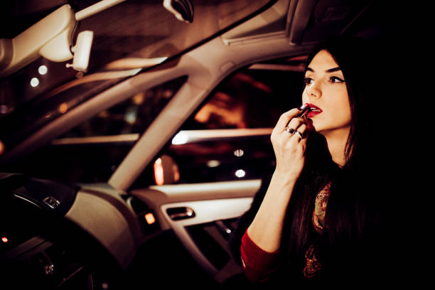 istock Young woman applying makeup 1199874635
