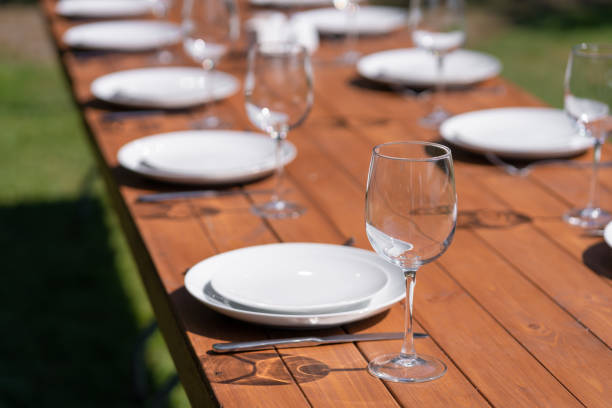 istock Served wooden table without a tablecloth. Cafe in the open air park 1199875698