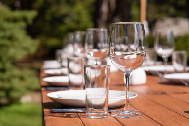 istock Served wooden table without a tablecloth. Cafe in the open air park 1199875807