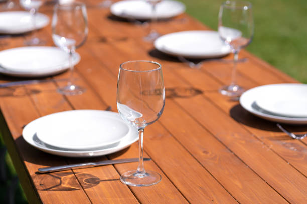 istock Served wooden table without a tablecloth. Cafe in the open air park 1199875927