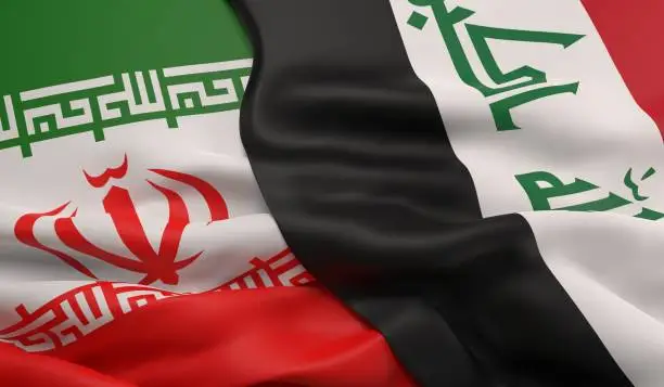 The flags of Iran and Iraq overlapping