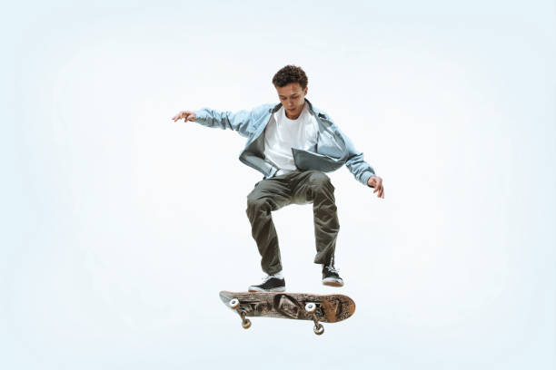 istock Caucasian young skateboarder riding isolated on a white background 1199878308
