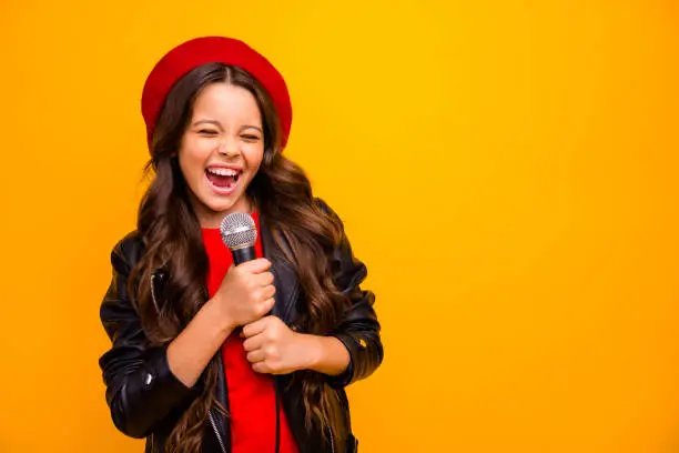 Photo of Close-up portrait of her she nice-looking attractive charming trendy fashionable cheerful wavy-haired girl singing karaoke hit isolated over bright vivid shine vibrant yellow color background