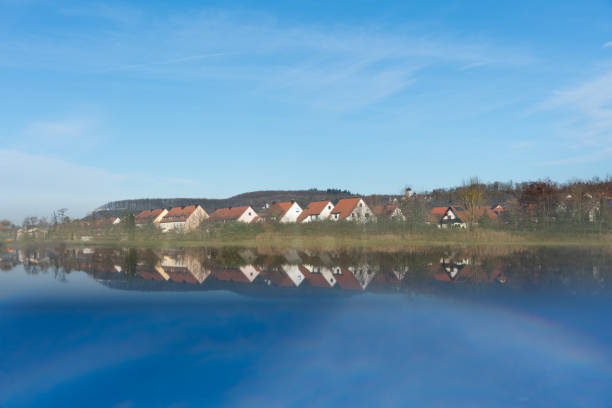 Picture showing the town of Scheinfeld in winter with a reflection produced by a prism making it seem to be near a lake