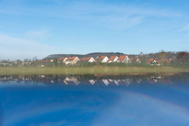 Picture showing the town of Scheinfeld in winter with a reflection produced by a prism making it seem to be near a lake