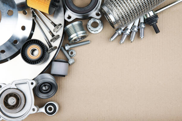 istock different modern car parts on cardboard background with copy space 1199883743