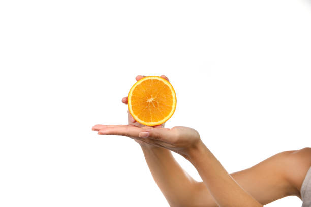istock Human hand with citrus fruit in the studio 1199884219