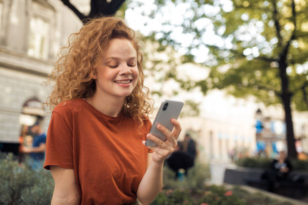 istock Young redhead talking to friends 1199884221