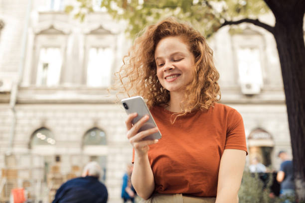 istock Young redhead talking to friends 1199884263