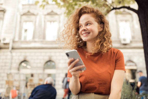 istock Young redhead talking to friends 1199884273