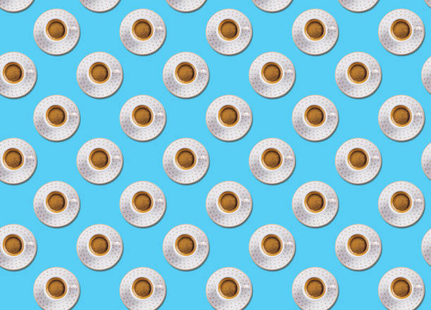 istock Cup of espresso coffee flat lay pattern on blue 1199885314