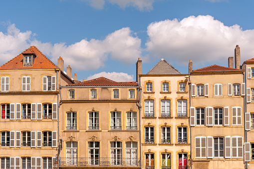 Typical old houses with chimneys along Place de Chambre town square in Metz, France