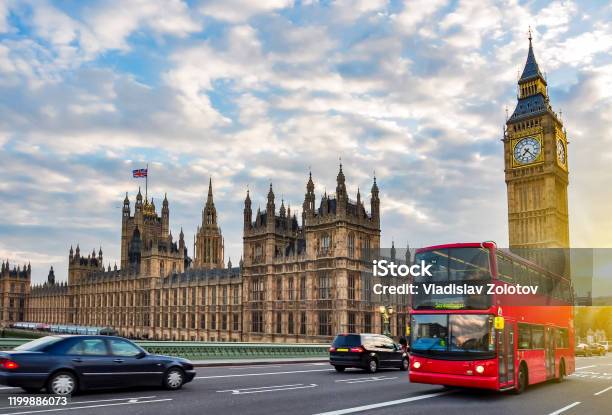 Houses Of Parliament With Big Ben And Doubledecker Bus On Westminster Bridge At Sunset London Uk Stock Photo - Download Image Now