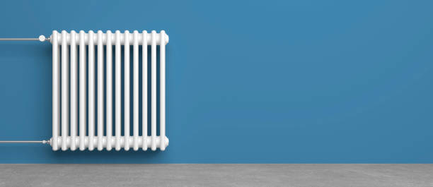 radiator heater technology radiator heater in living room in front of wall as template radiator heater photos stock pictures, royalty-free photos & images