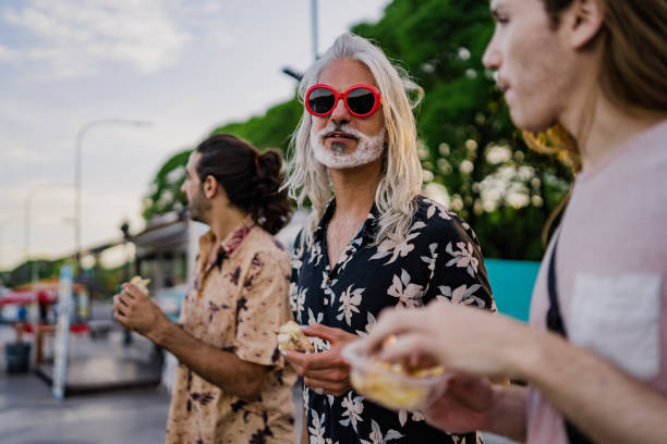 istock Three Argentinian men eating street food 1199887078