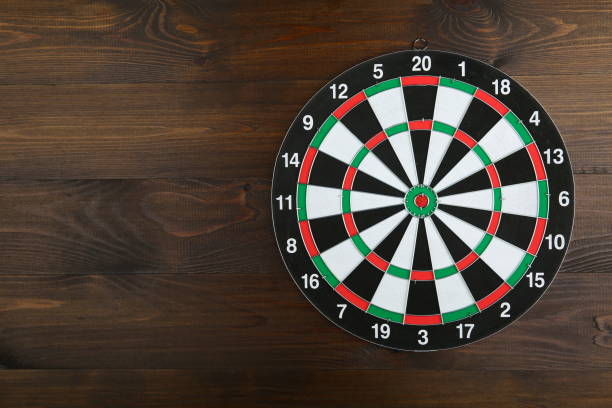 istock dartboard on a wooden background with copy space flat lay 1199887154